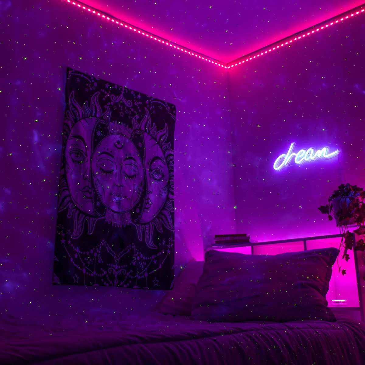 A bedroom lit by a purple projected nebula