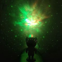 A green nebula projected across a room