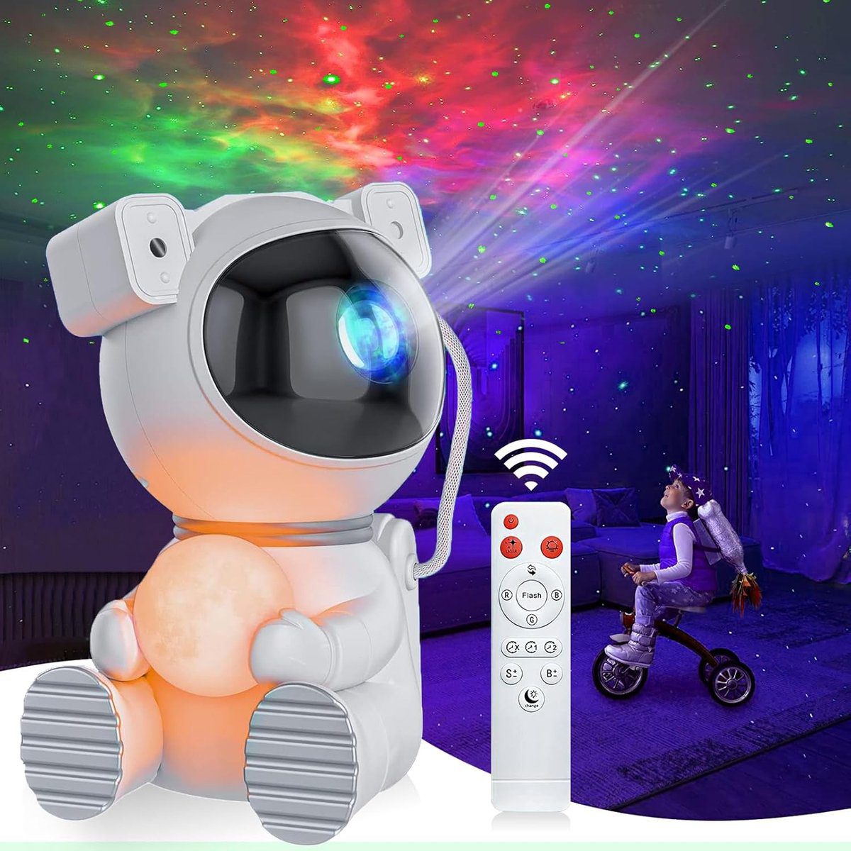 Moon astronaut star projector holding its lit moon lamp, coloured nebula on the wall behind it